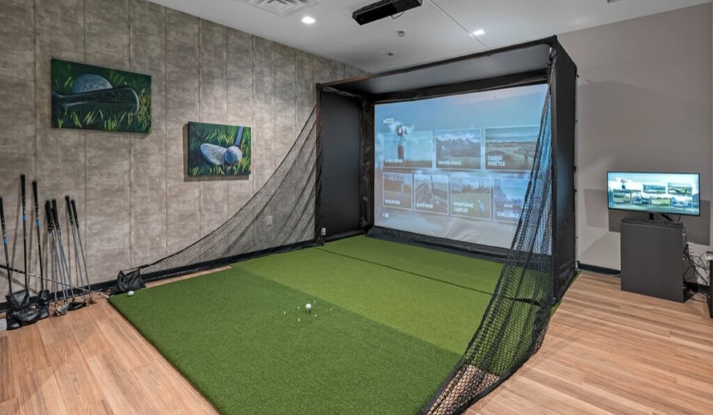 Indoor golf simulator with screen and netting