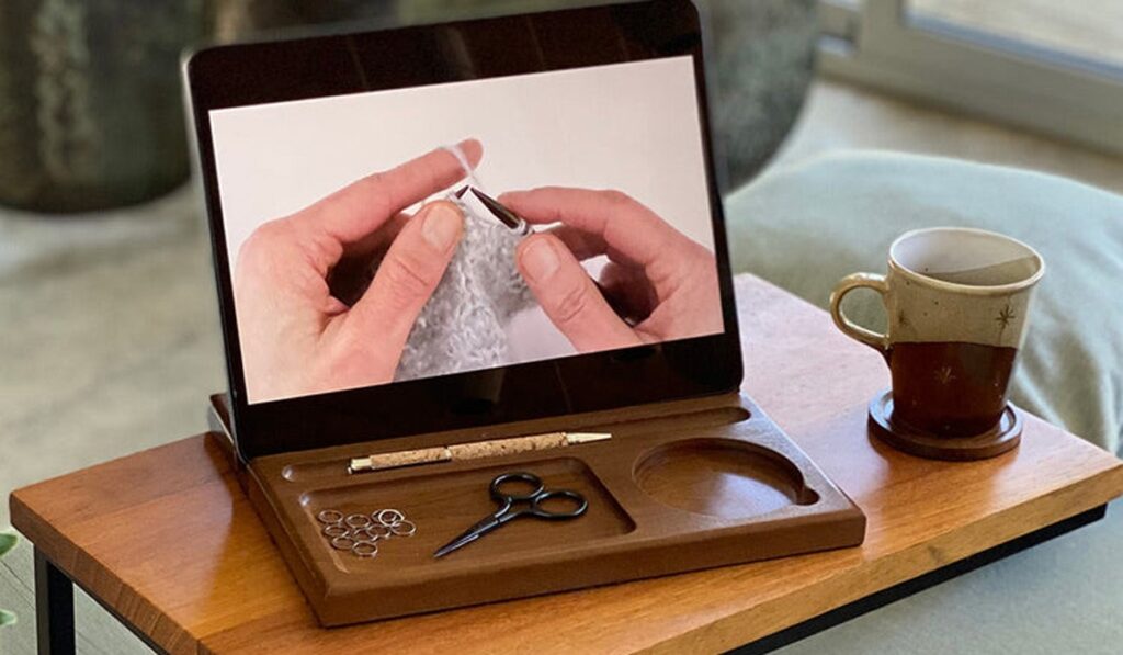 Tablet showing knitting tutorial on lap desk
